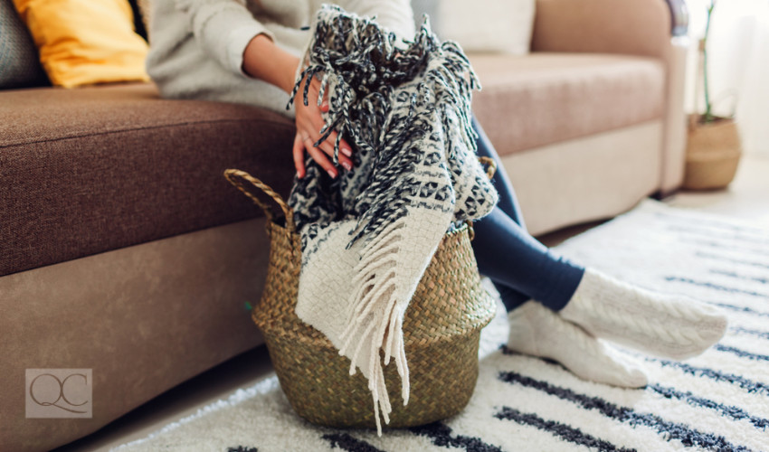 throw blanket in decorative basket for interior decor