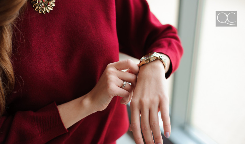 professional woman checking watch for time