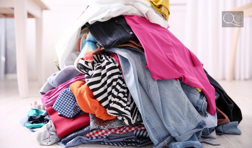 piles of clothes in decluttering process for konmari method