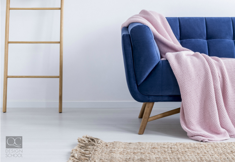 Blue sofa in a minimal and clean living room.