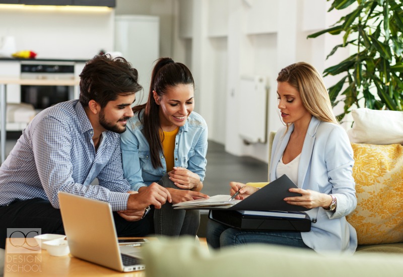 real estate agent in staged home with clients