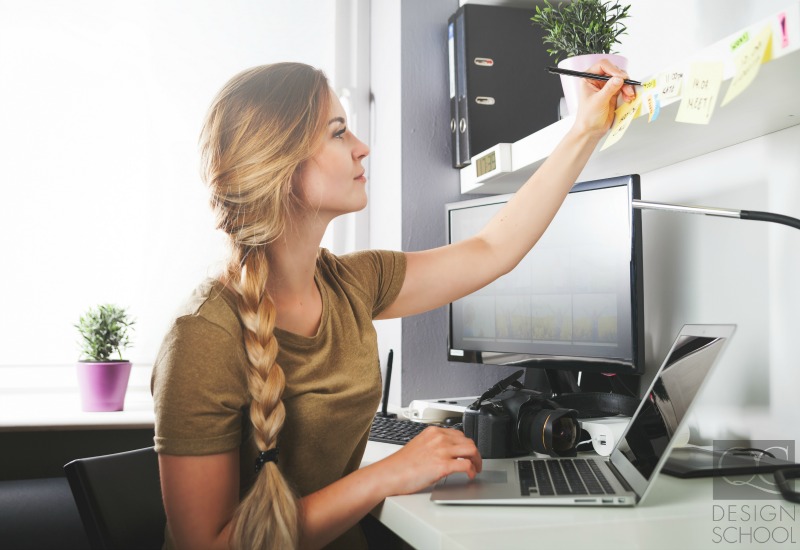 woman writing at desk