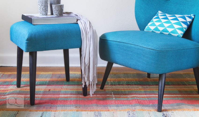 blue living room chair and stool for books