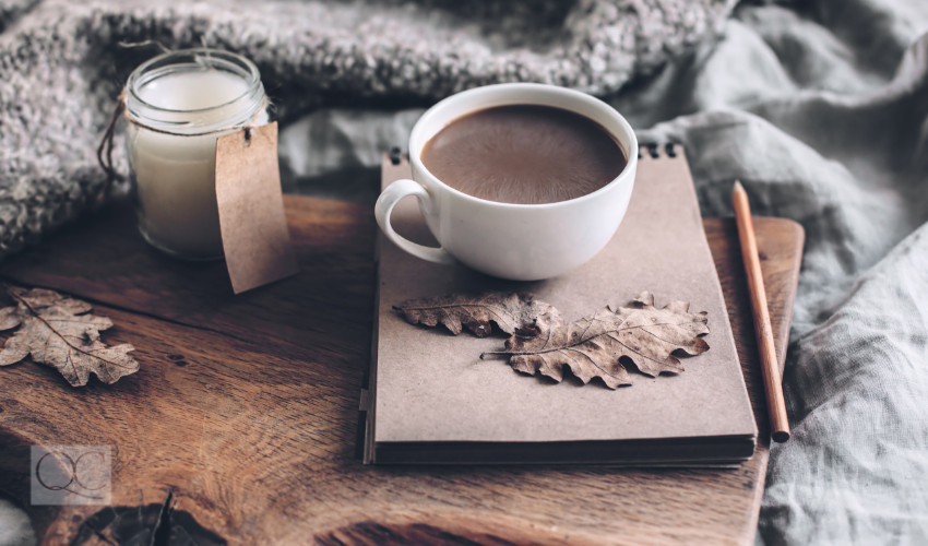 self care coffee candle and cozy blankets