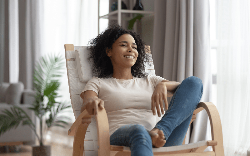 happy woman relaxing in feng shui-designed home