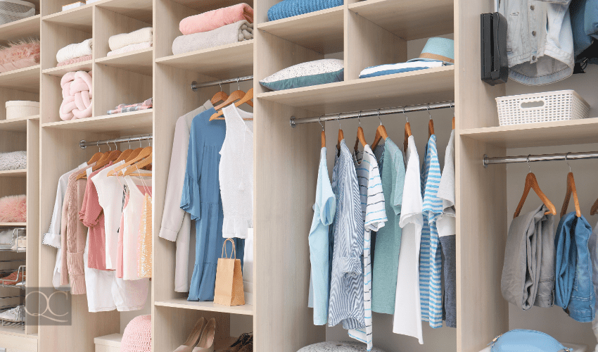 clothing closet organized by certified professional organizer