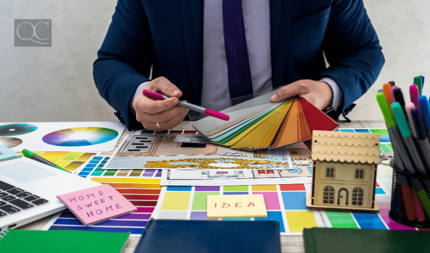 color consultant displaying color swatch options at desk