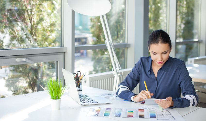 Talented female freelancer is working in office