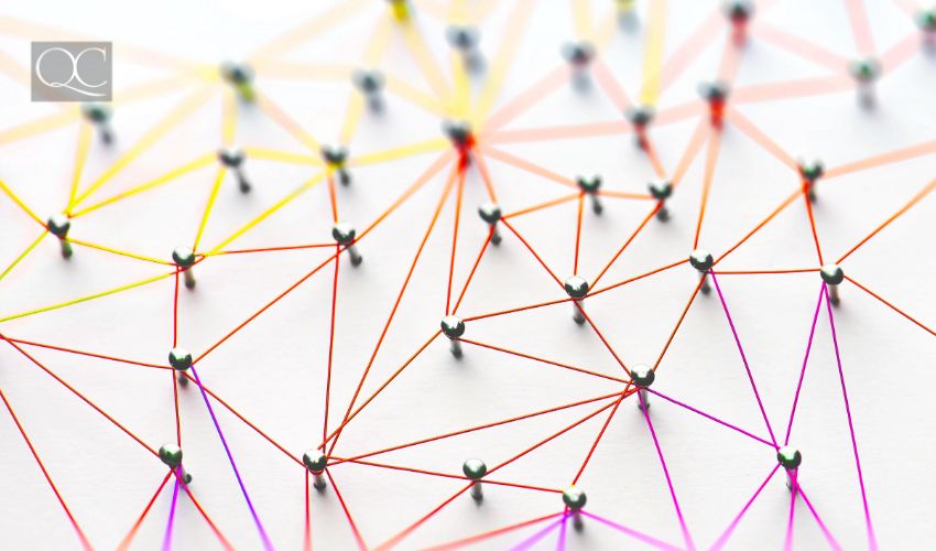 Linking entities. Networking, social media, SNS, internet communication abstract. Small network connected to a larger network. Web of red, orange and yellow wires on white background.