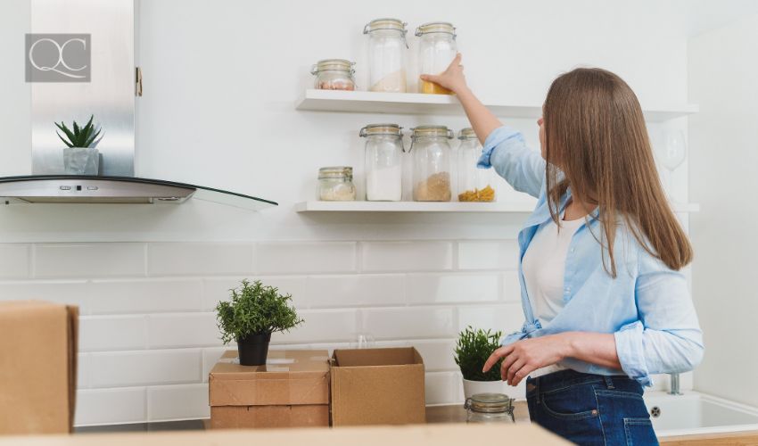 How to become a professional organizer article, last in-post image, woman organizing kitchen shelves