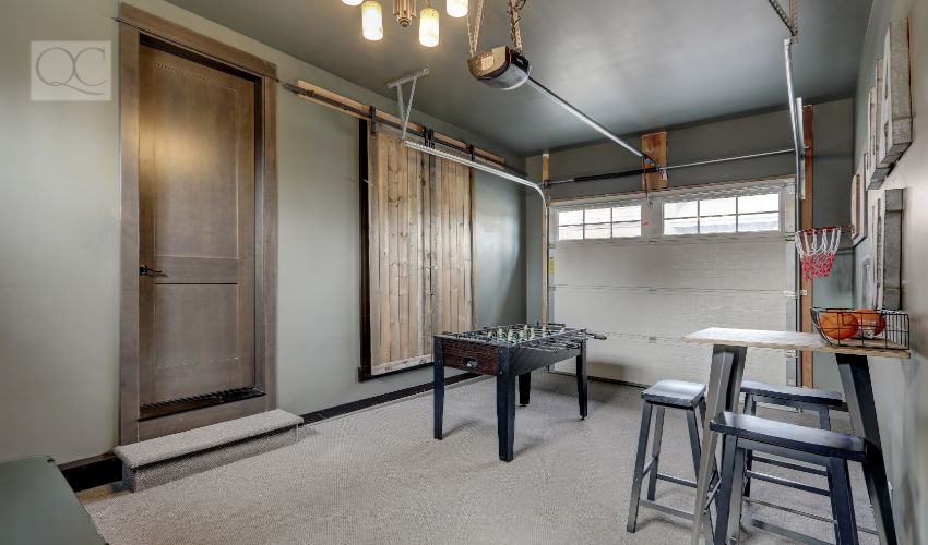 Modern garage interior with fun family play room with hockey table