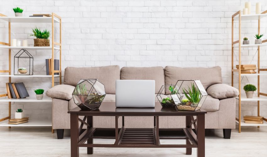 Staged room. Scandinavian interior. Room with wooden table and glass florariums