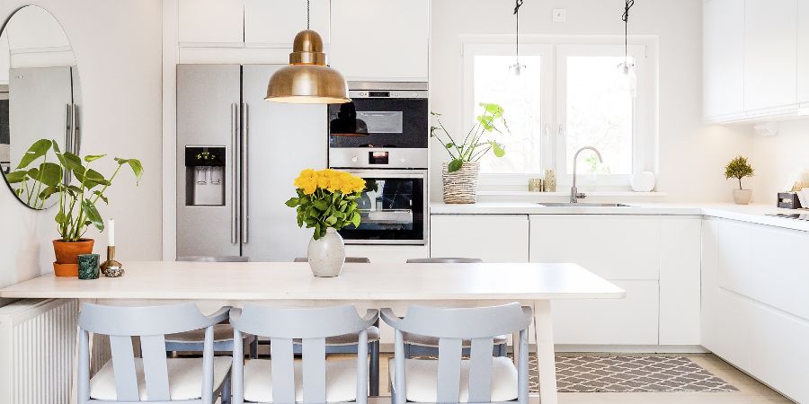 front view banner of a kitchen table in a fancy bright kitchen. Feng Shui article.